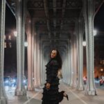 eya Mnangagwa on a Paris bridge at night, reflecting on faith and fashion