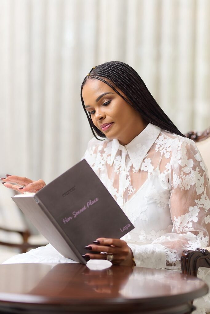 Leya Mnangagwa reading her Her Secret Place journal, reflecting on her secret place of prayer